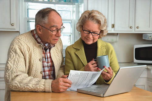 Older couple reviewing financial information